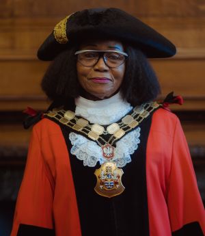 Mayor of Islington Councillor Rosaline Ogunro wearing a red robe and the Chain of Office