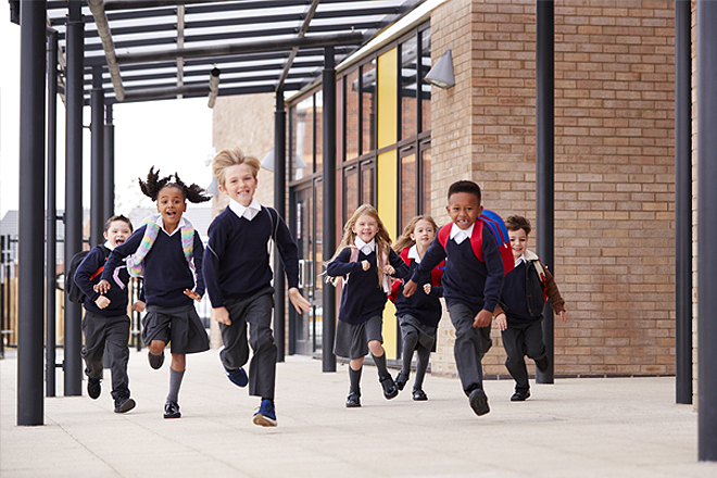 School children running outside school